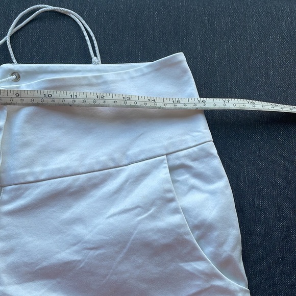 SOLD—VINTAGE Betsey Johnson white shorts with bauble buttons and tie back - Picture 6 of 9